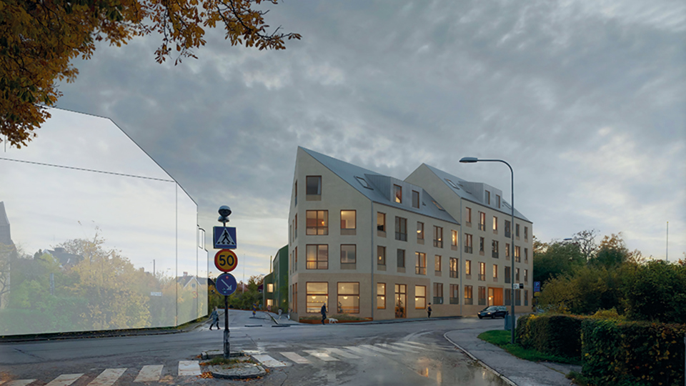 Vägkorsning med flerbostadshus i ljus färg till höger i bild. Till vänster om korsningen är ett annat flerbostadshus inritat som en genomskinlig skiss. Träd, häckar, vägmärken och människor i rörelse längs gatan. Illustration